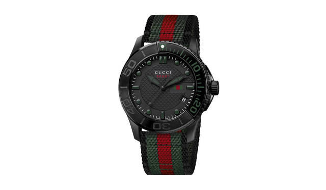<strong>GUCCI｜Gucci</strong>A distinctly Gucci timepiece, featuring a black PVD-coated stainless steel case paired with a green-red-green Web stripe nylon strap. "G-Timeless Sport" ¥122,850. Scheduled for July release.