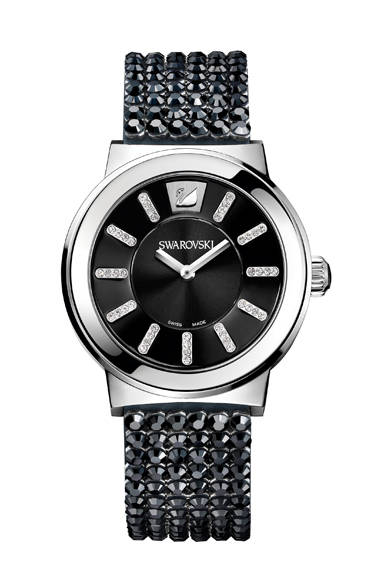 The "Piazza" model features a jet hematite crystal mesh strap and a dark gray dial. The indices, made with clear crystal chatons, offer a novel design. The exquisite balance between poetic sensibility and architectural design captivates the eye.<br /><br /><strong>Piazza</strong><br />¥91,350<br />Quartz, 36mm diameter, Stainless steel x Jet Hematite x crystal<br /><br />Swarovski Japan (Customer Relations)<br />Tel. 0120-10-8700<br />www.swarovski.co.jp