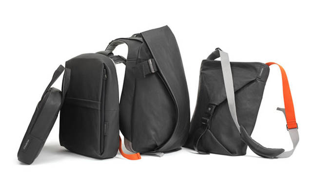 <strong>LIVING MOTIF</strong> | Introducing the "Coated TechnoCanvas" series (not released in Japan), treated with water-repellent wax. From left: Laptop Carrier ¥21,840, Flat Backpack ¥26,670, Laptop Rucksack ¥39,270, Vertical Tote ¥23,520 (all models fit 15-inch laptops).
