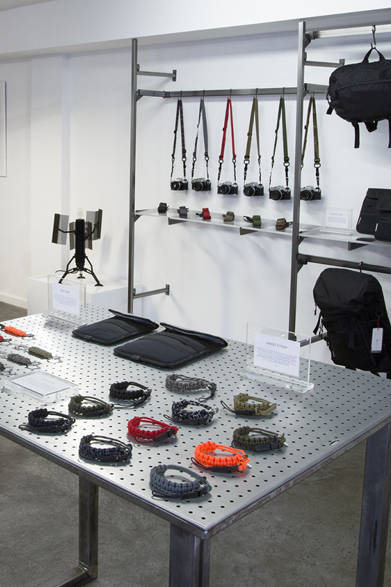 The lineup includes items such as business bags, backpacks, laptop cases, and iPad cases. All products are made with highly durable materials, including water-repellent 1680-denier ballistic nylon, Duraflex zippers, and Mil-spec webbing.