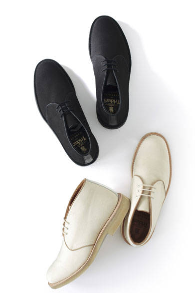 Completing the look are Tricker's bespoke chukka boots. Made with canvas uppers and crepe soles, they come in white and black. A contrasting material at the heel adds a subtle accent. Boots ¥85,320 (Margaret Howell)