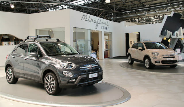 Fiat 500X displayed in front of the official merchandising shop.