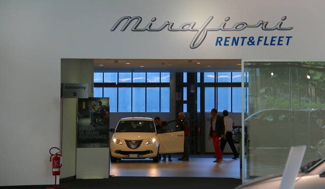 Delivery area. New cars are picked up one after another.