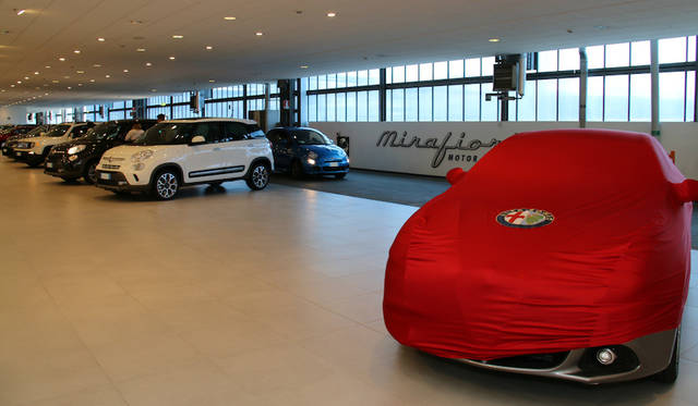 Delivery area. New cars are picked up one after another.