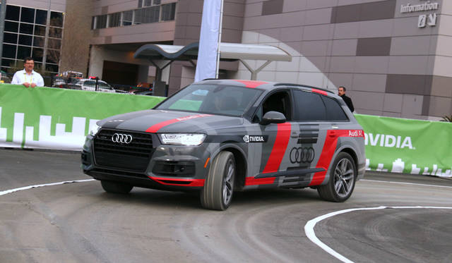 Audi, together with semiconductor company NVIDIA, conducted a ride-along demonstration of an AI-driven autonomous vehicle outdoors. No one was in the driver's seat. The vehicle, already familiar with its regular route, automatically rerouted when it recognized a temporary traffic signal at a construction site.