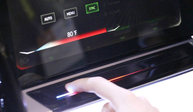 From Volkswagen's futuristic "Digital Cockpit" dashboard display. Climate control uses haptic touch, providing tactile feedback to the fingers, similar to smartphone interfaces.