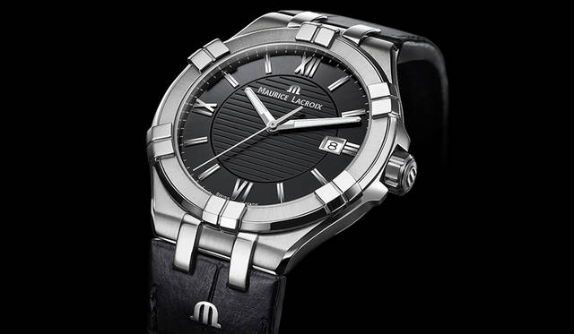 The twin-block design on the bezel and lugs is eye-catching, lending the case depth and a play of light and shadow. The strap features the initial “m,” a revival design that echoes details from the brand’s early days.