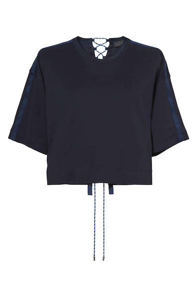 A cut-and-sew top featuring a boxy fit, cropped length, and a relaxed, loose feel. The combination of different materials and the strings on the back add a light, sporty mood. Cut-and-sew ¥26,000 (DIESEL BLACK GOLD)