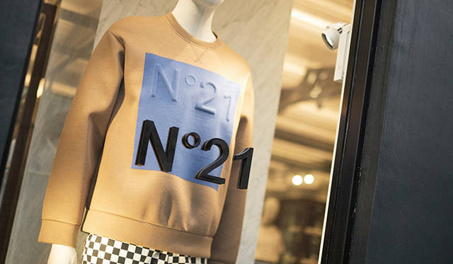 The shop's first-floor display window. The neoprene top, with its embossed brand name, is from the Spring/Summer 2015 collection.