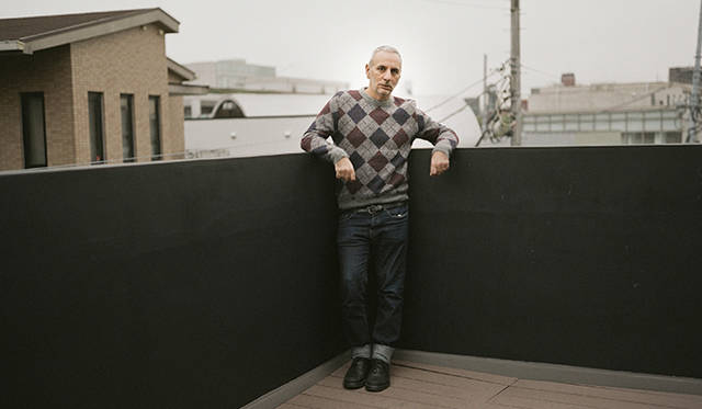The photo shows Alessandro Dell'Acqua, taken on the terrace of the flagship shop's third floor.