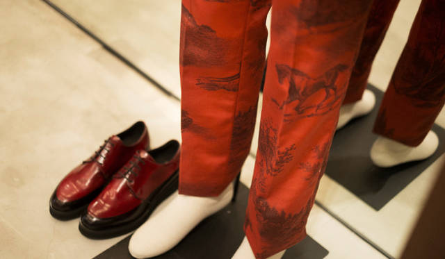 Trousers and shoes from the Autumn/Winter 2014-15 collection, printed with images of horses and a grassy landscape.