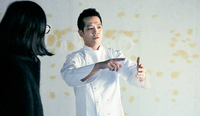 Suga explains his vision for the lab at the construction site.