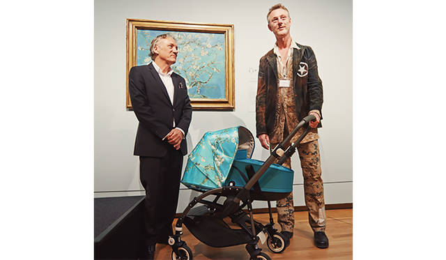 From left: Willem van Gogh, grandson of Van Gogh's nephew and advisor to the Van Gogh Museum, and Max Barenbrug, founder and chief designer of Bugaboo, unveil the "Bugaboo Bee³ + Van Gogh" in front of the artwork.