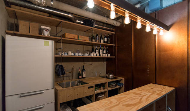 A neatly organized kitchen is located to the left upon entering the entrance