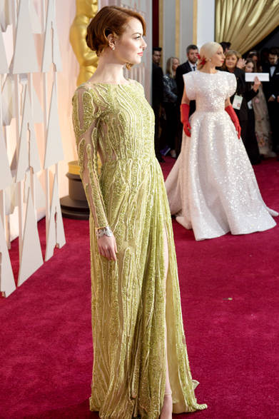 <strong>Tiffany & Co. <br>for Emma Stone</strong><br><br>Cuff bracelets from Tiffany peek out from the cuffs of her long-sleeved dress.