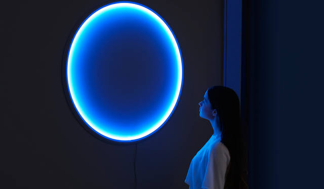 "Luz," conceived by artist Marina Meliadò Mendieta, who mentioned it was inspired by cities with little sunlight, is an indoor lighting system that changes its light color sensitivity in response to external weather conditions.