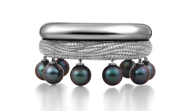 The "DEEP SEA TREASURE" features Tahitian pearls suspended from a white gold cuff bracelet © Tiffany & Co.