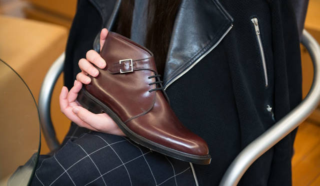 Her first design model, the "COMBE" ankle boot, features a lace-up and single monk strap design on the new 0015 last.