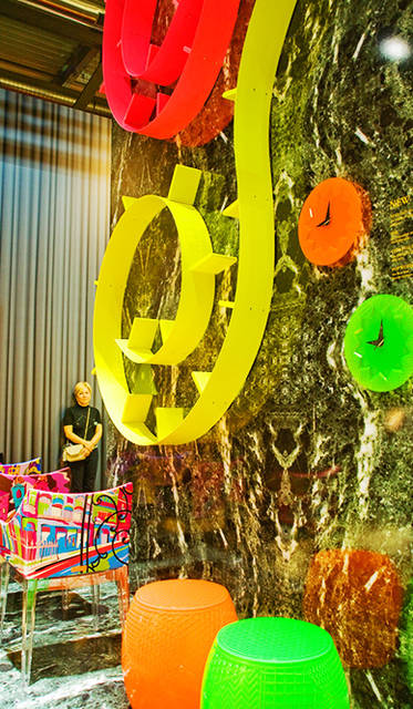 Bookshelf "POPWORM" by Ron Arad, Chair "MADAME – World of Emilio Pucci edition" by Philip Stark, Clock "CRYSTAL PALACE" by Alessandro Mendini, Stool "ROY" by Alessandro Mendini<br> The "MADAME – World of Emilio Pucci edition" chair by Philippe Starck features four color textiles inspired by the cities of Paris, Rome, New York, and Shanghai.