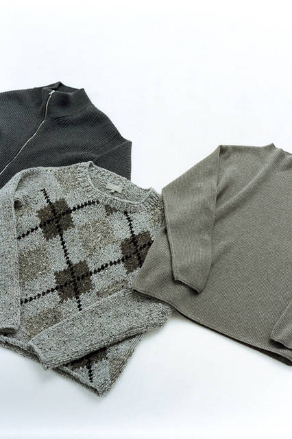 Left: The zip cardigan, finished with a hand-knitted look, has a slim silhouette and can be worn as outerwear. Zip cardigan ¥73,440. Center: The hand-finished Aran sweater is a key look from the collection, with a chunky feel and outstanding presence. Knit ¥129,600. Right: The wool-cashmere knit features a trendy bottle-neck design this season. Its simple finish, apart from the collar's knit arrangement, makes it ideal for layering. Knit ¥73,440 (all Margaret Howell) [Store exclusive: Jinnan, Kobe, Umeda, Kyoto, Tenjin stores].