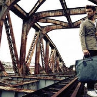 Lighten your step with ecru linen. Set off on a journey with a bag from TRAVER