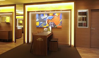 Japan's 11th Breitling Concept Shop. The interior features a unique concept with American pop art set against a backdrop of contrasting wood and steel.