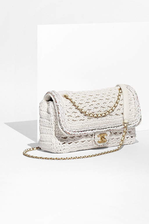 White toile backpack embroidered with golden and white sequins